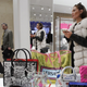 A woman in a furry vest shops at Neiman Marcus in New York